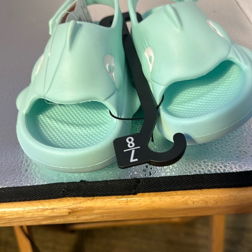 New tags adorable sandals for children. Size 7 to 8 they look like a shark.​​